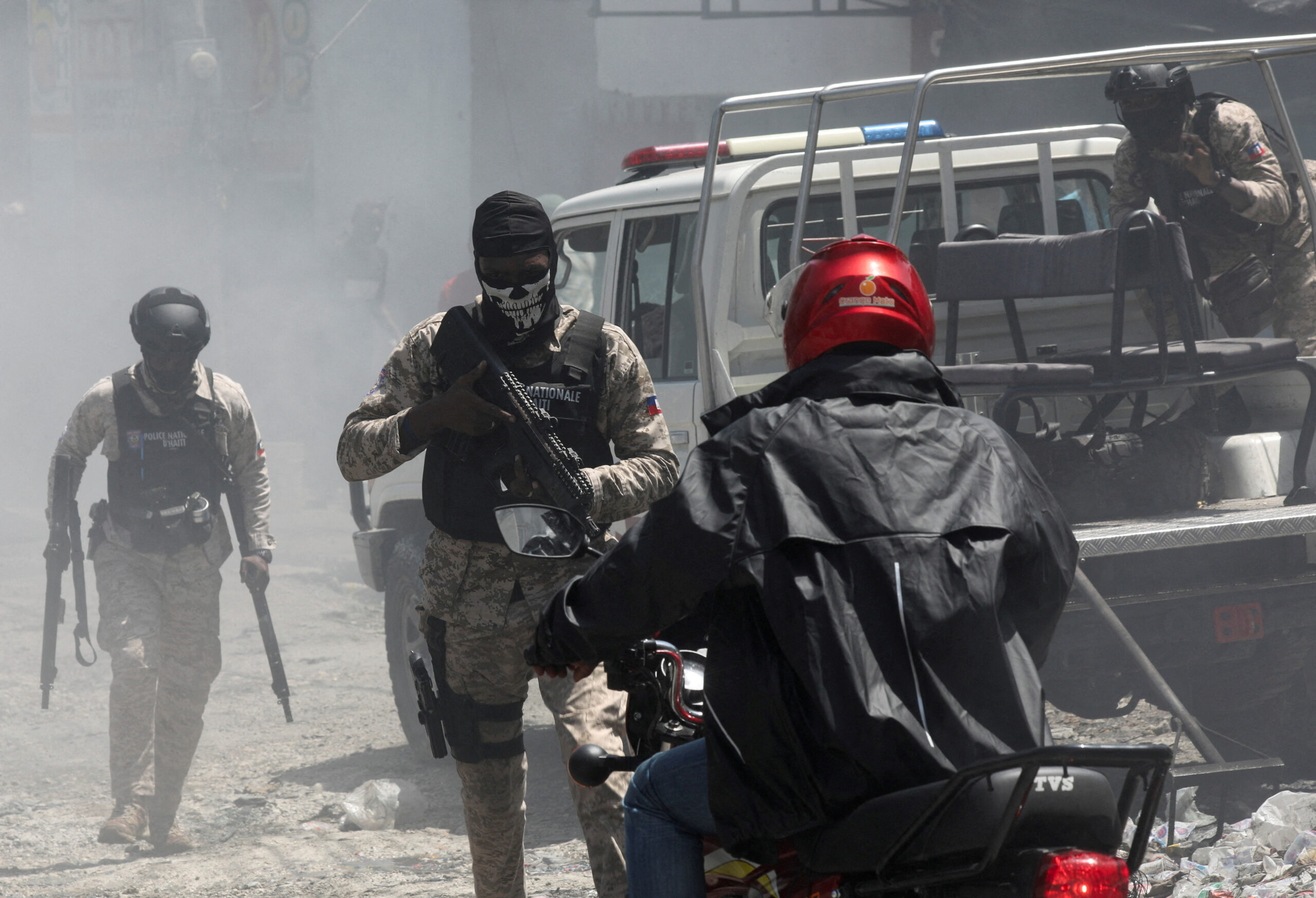 Gang in Haiti massacres 70; leader blames victims as thousands flee